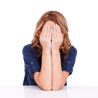 Woman Hiding Her Face With Hands